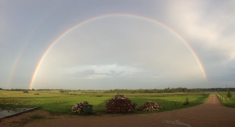 Double rainbow to the East. The gate seems to be wide open for me. Photo taken at the motel Golden Fox, a wonderful family driven accommodation with very nice hosts<br />[+56.520936 +27.507544]